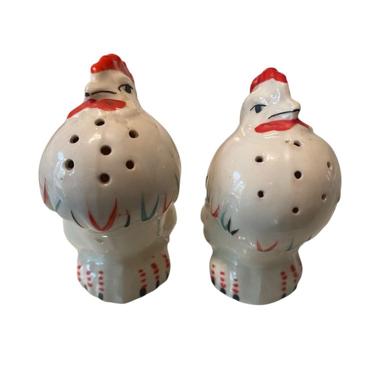 This is a pair of vintage mid-century rooster and hen ceramic salt and pepper shakers made in Japan.