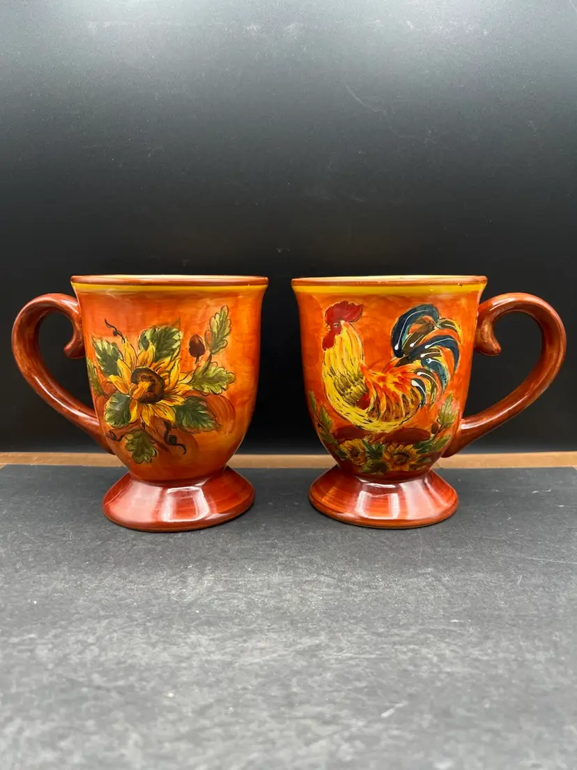 #591B Beautiful Set of 2 Maxcera Hand Painted Orange Rooster And Sunflower Footed Ceramic Coffee Mugs