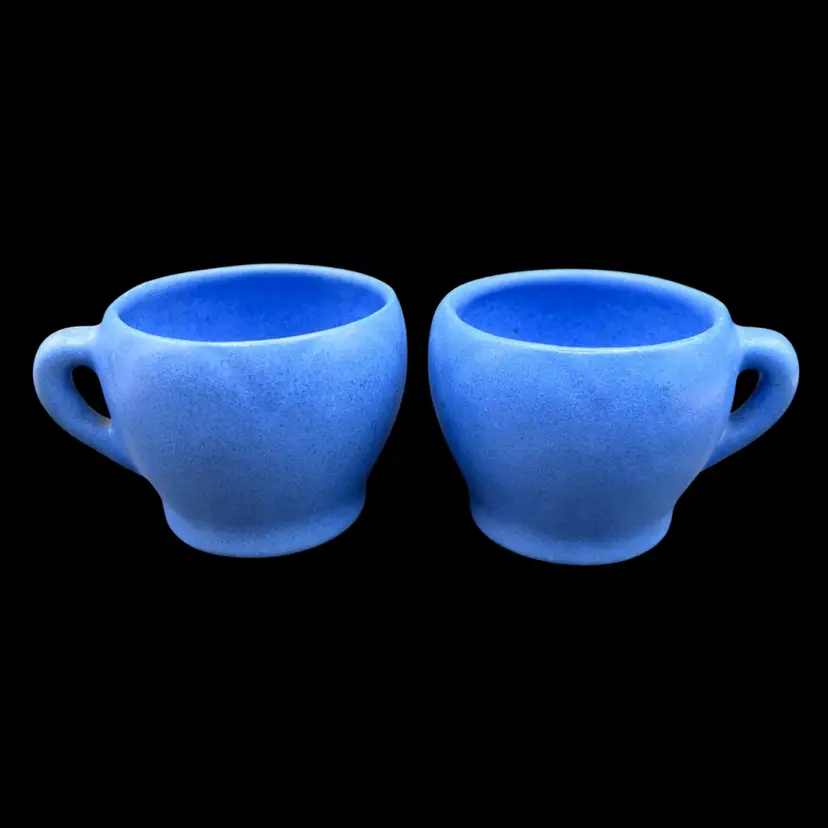 #138B Pair Of Vintage Pottery Cornflower Blue Coffee Cups With The Tiniest Handles.
Depression Era Hand Made Unmarked.