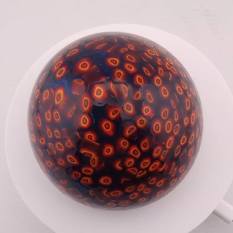 Orange and cobalt blue millefiori paperweight
