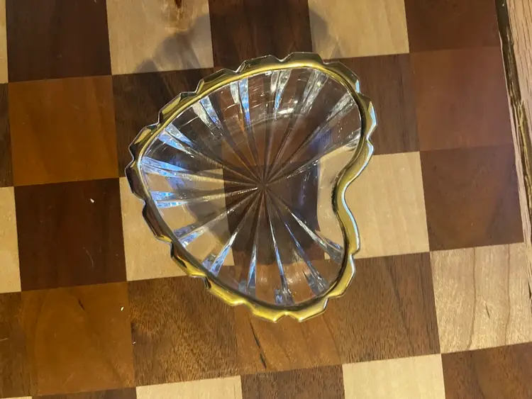 A Mikasa heart-shaped glass dish with a gold-tone rim. 3-4”