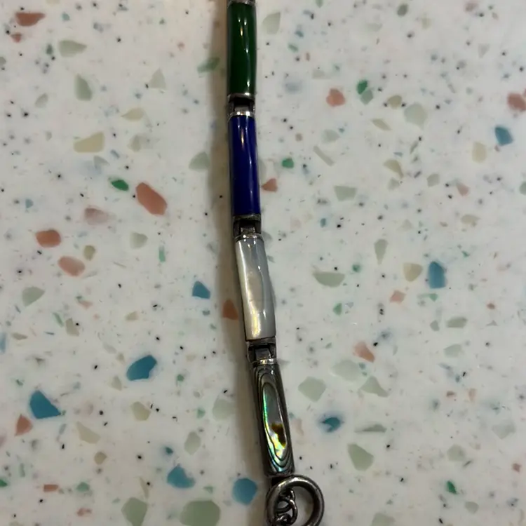 7 Section Bracelet With Varied Stones In Each Link. Toggle For Connecting On Wrist. Marked CAA On Each Link