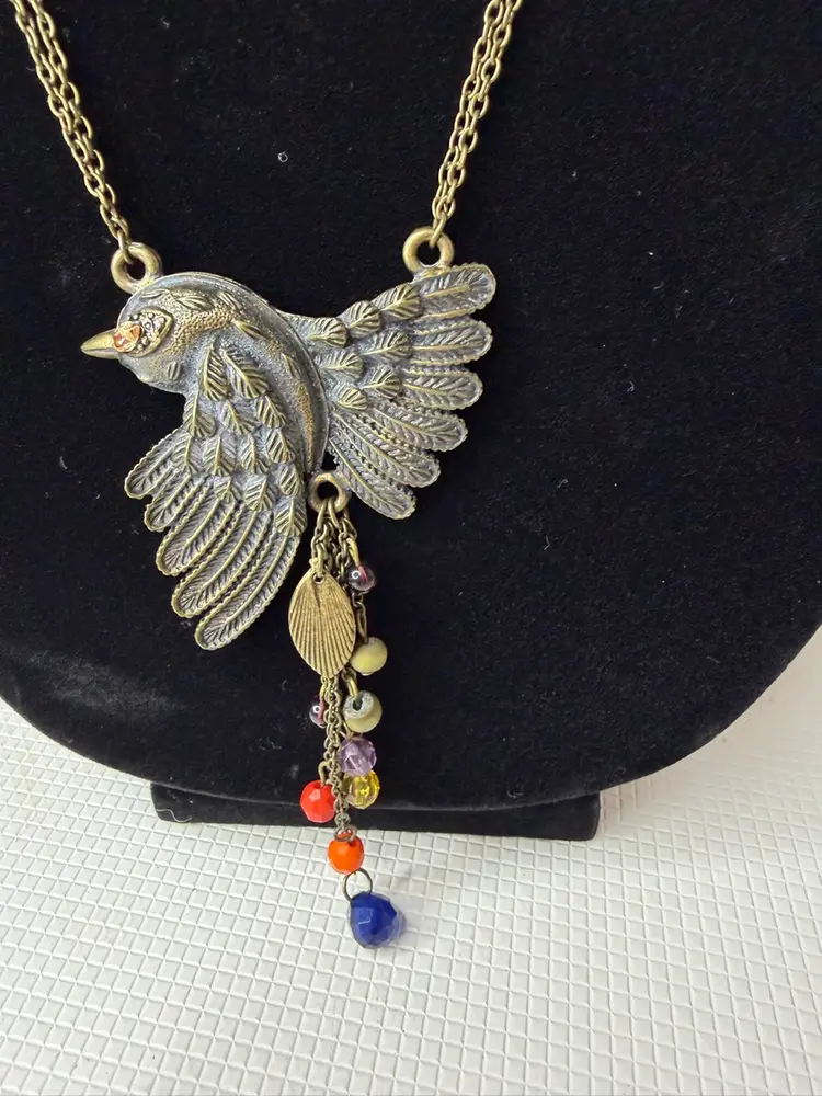 Bird Necklace Tag Says Ice