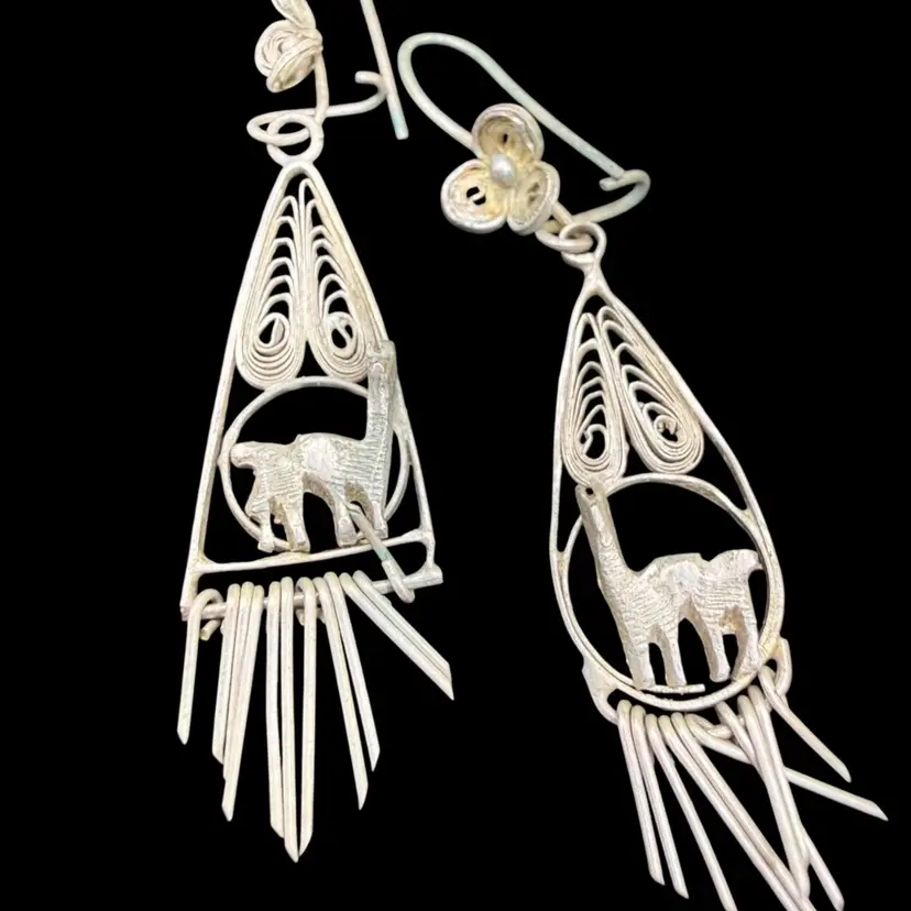 vintage sterling silver filigree dangle hook earrings featuring an alpaca motif.