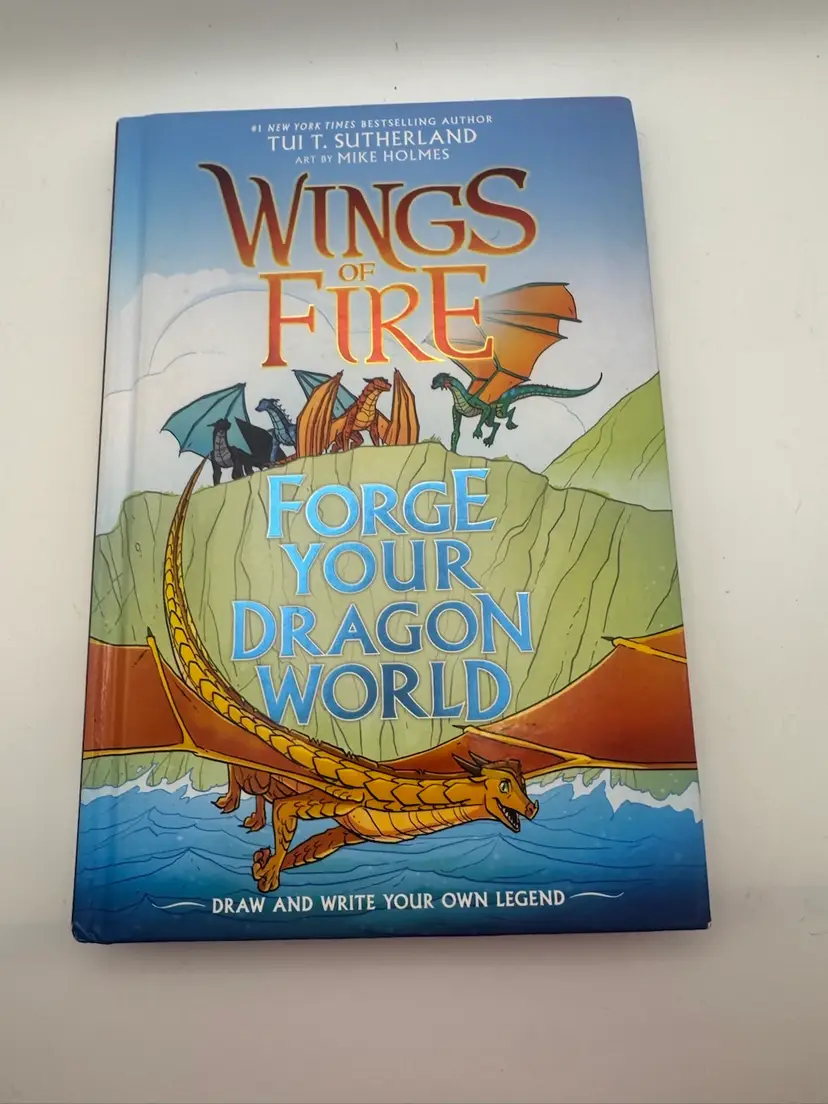 Young Reader/Teen Book ‘Wings Of Fire - Forge Your Dragon World A Draw And Write Your Own Legend’ - Tui. T. Sutherland CR 2021