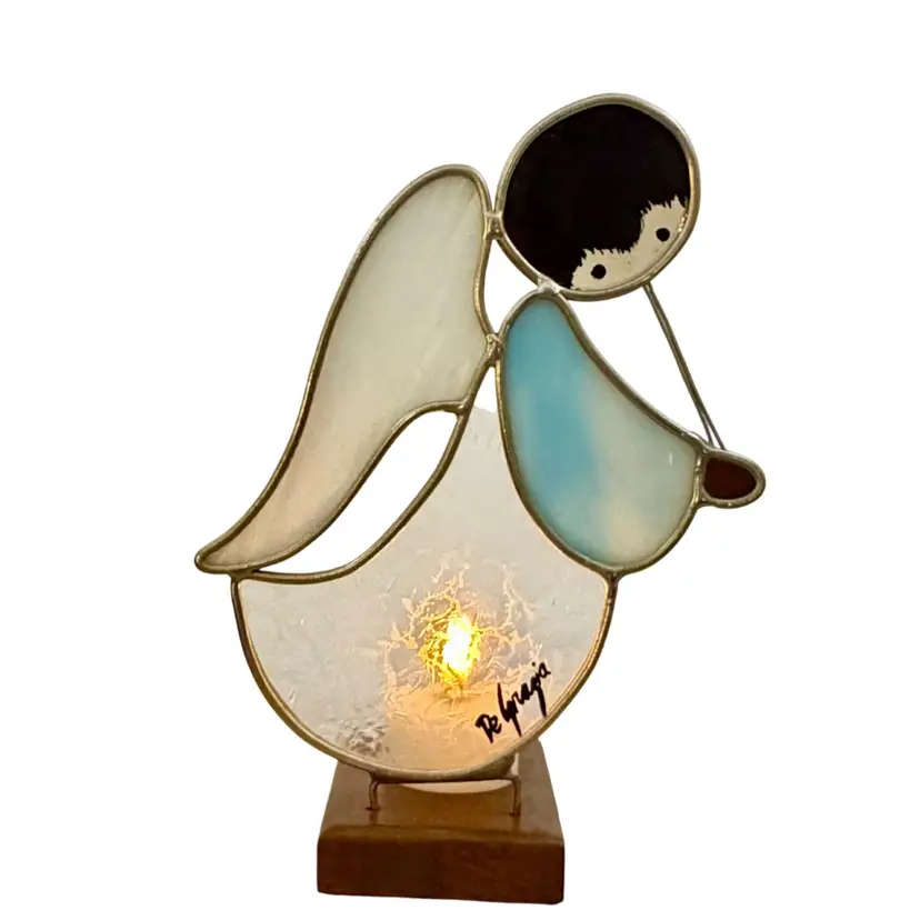 1980 Ted DeGrazia•Ken Toney Stained Glass Angel Figurine With Flute Wood Base Flameless Tea Light Holder Light Blue & White Signed
8” T x 5.5” L x 2.5” W