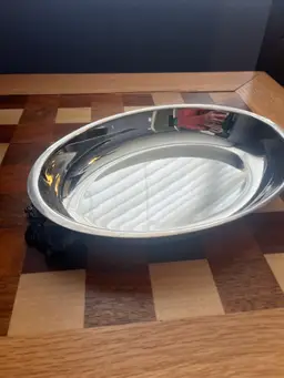 #01 Vintage stainless steel oval serving tray with ornate handles.