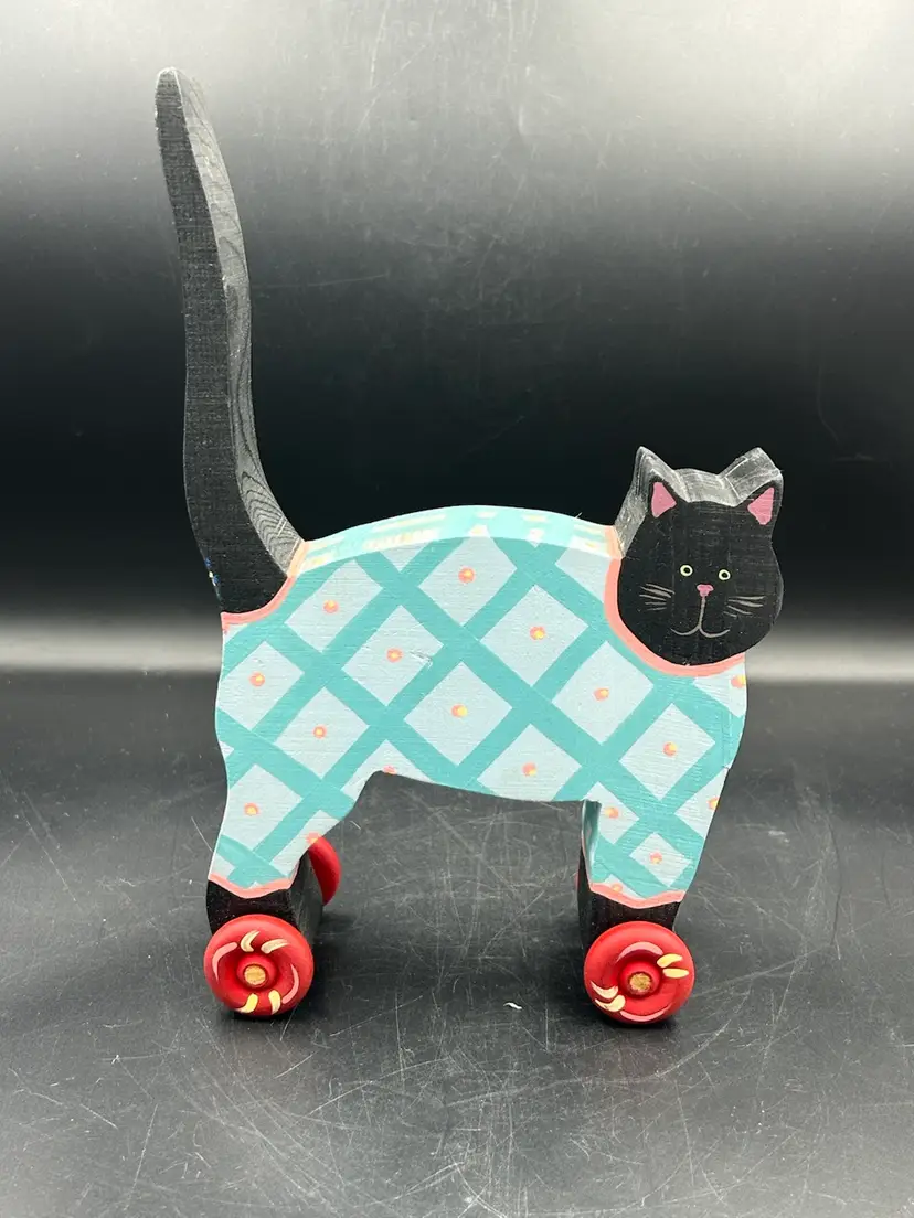 Wood Blue And White Checkered Smiling Cat On Red Wheels Figurine