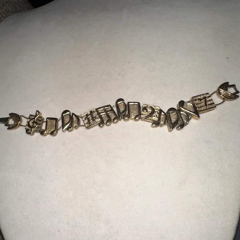 1995BB gold tone music note slider bracelet