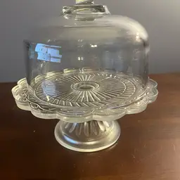 Vintage  pressed glass cake stand with a domed lid/cloche.
This Is A More Petite Cake Stand So It Would Be Good For Macaroons Or Cookies Or Decor.
9 inches tall with lid cake stand is 3.5 inches tall 8 inches wide