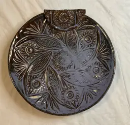 #01 Handmade pottery plate, 10” round, beautiful bluish purple glaze, with a unique folded piece that adds a wonderful touch. Initialed with JS 14