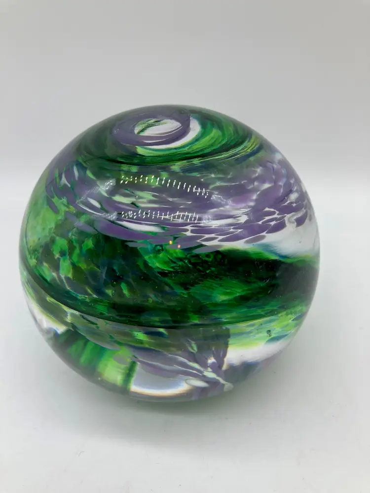 Green and Purple Swirls in a Glass Paperweight, Stamped 'Made by ME'