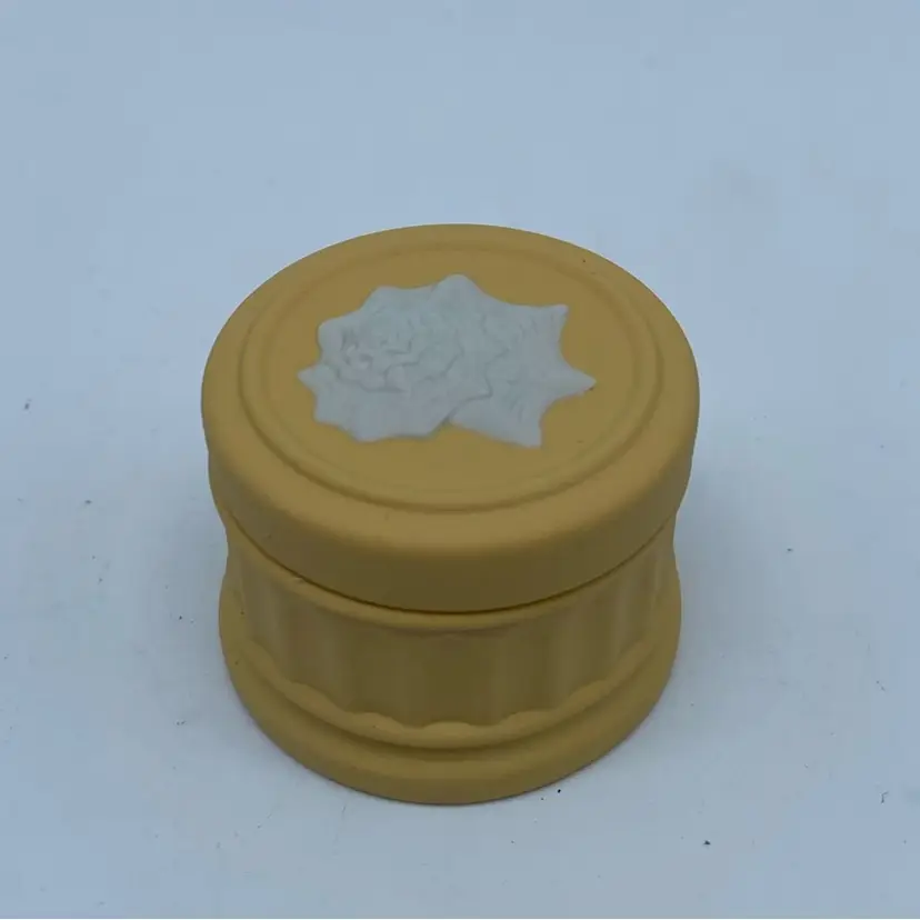 #4119 Wedgwood primrose yellow Jasperware trinket box with relief decoration.