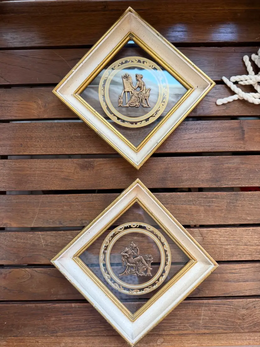 Beautiful Pair of vintage decorative wall plaques with classical bas-relief medallions.