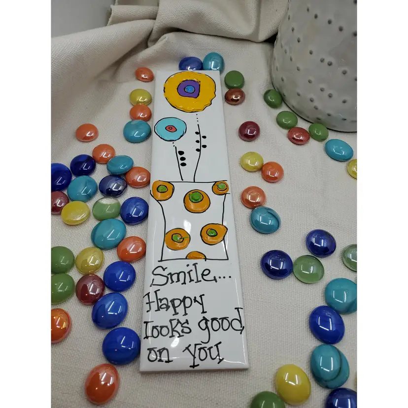 SMILE... HAPPY LOOKS GOOD ON YOU
Whimsical Handpainted Flowers On Italian Tile 2.25" X 9.75" Ready To Hang Signed By Artist