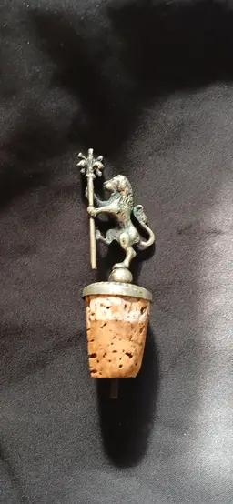 This Vintage HERALDIC RAMPANT LION W/Staff WINE CORK BOTTLE STOPPER is a unique and elegant addition to any kitchen or barware collection. The intricately designed lion pattern adds a touch of vintage charm, while the cork material ensures a secure seal to keep your wine fresh. Perfect for collectors or those looking for a stylish way to seal their favorite bottles, this bottle stopper combines functionality with a touch of old-world flair.