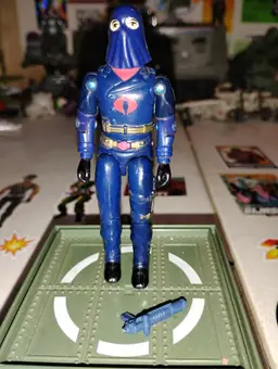 G.I. Joe Cobra Commander action figure, specifically the hooded version (V2) from 1982-83