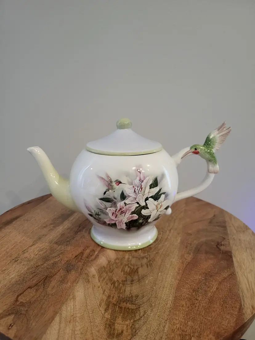 Teapot Hummingbird and Lilies by Lena Liu and Teleflora