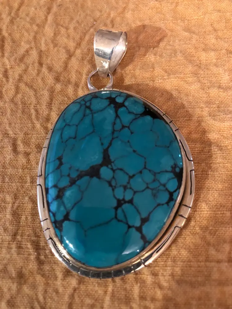 Turquoise And Silver Pendant