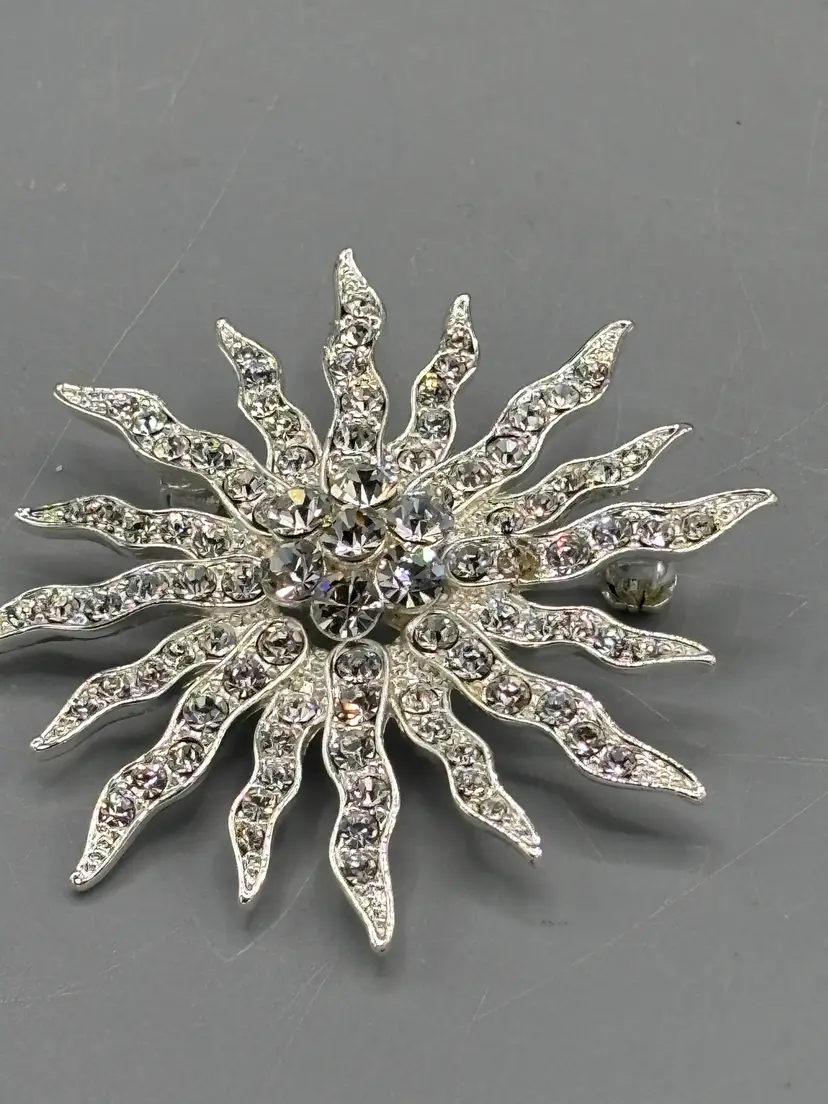 Vintage silver tone Rhinestone sunburst brooch