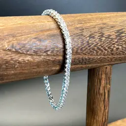 White Gold Plated, Tennis Bracelet With Cz’s. 7 Inches Long.