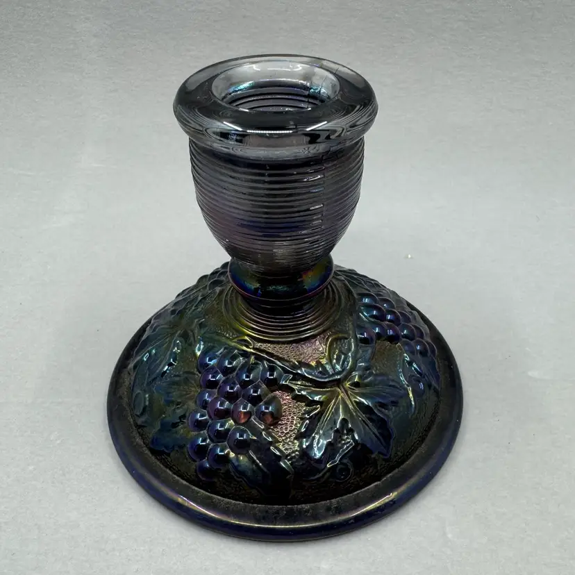 Amethyst Imperial carnival glass candlestick holder with grape and leaf motif, Early 1900’s
