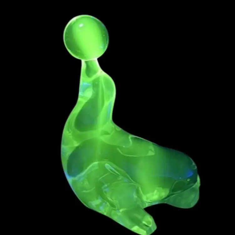 Clear Glass Seal With Ball Figurine/Paperweight/Bookend Viking Glass New Martinsville No. 452  UV Glow
7” T x 5-1/2” L x 5”W