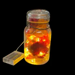 Quart Mason Jar Double Safety With Metal Latch Filled With Pumpkin Lights And Leaves.