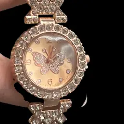 #256A Rose Gold Colored Women’s Quartz Wristwatch Featuring A Butterfly Face And A Rhinestones Studded Band
In very good condition, Never Worn
Fits up to an 8” wrist. Band is 5/8” wide, watch face is 1 1/4”