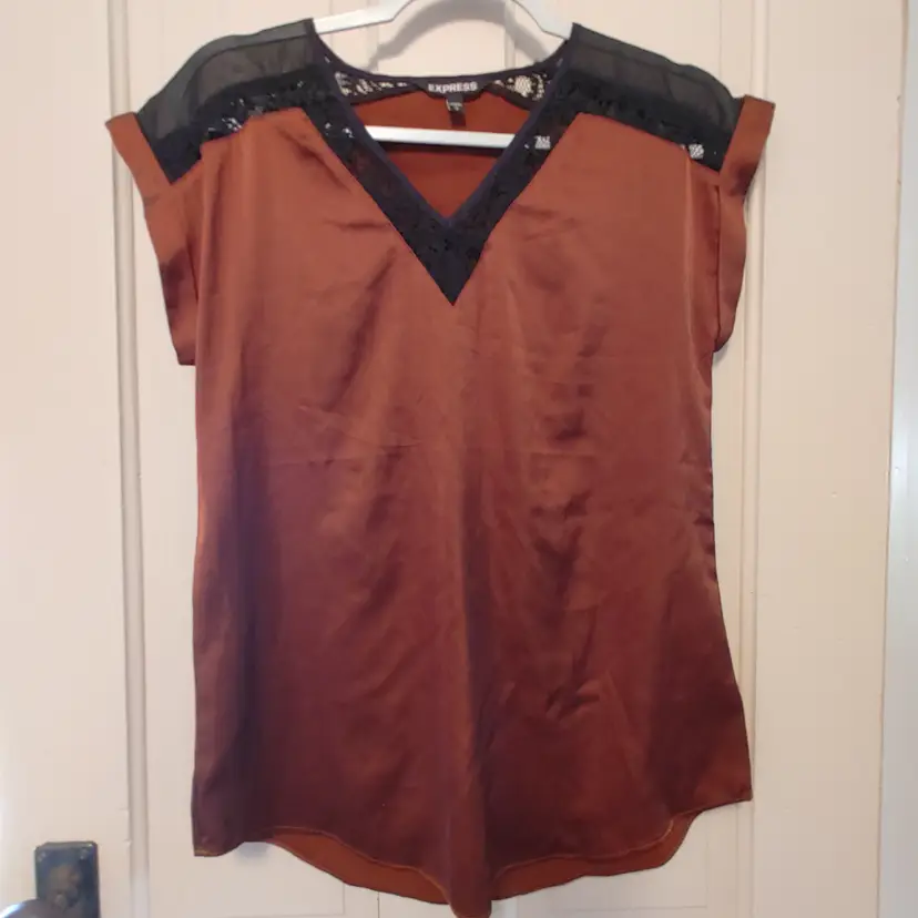 Top- Brand: Express. Size Small. Brown and black lace top. Material- 98% polyester, 2% spandex. No callouts.