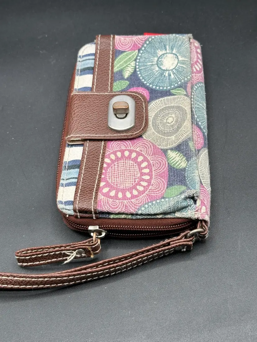 Unionbay brand patchwork canvas and faux leather wristlet wallet featuring floral and striped patterns.