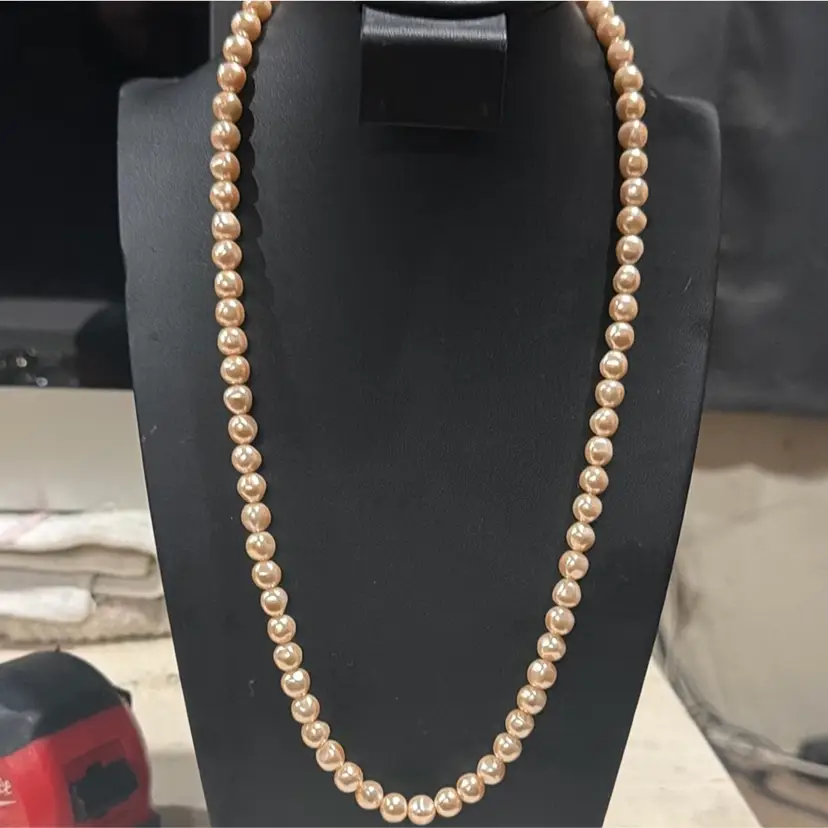 faux pearl peach color 11” long