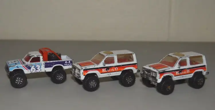 Vintage Matchbox Ford Bronco II Models: 1987 White, Orange, Chrome and 4x4 Truck