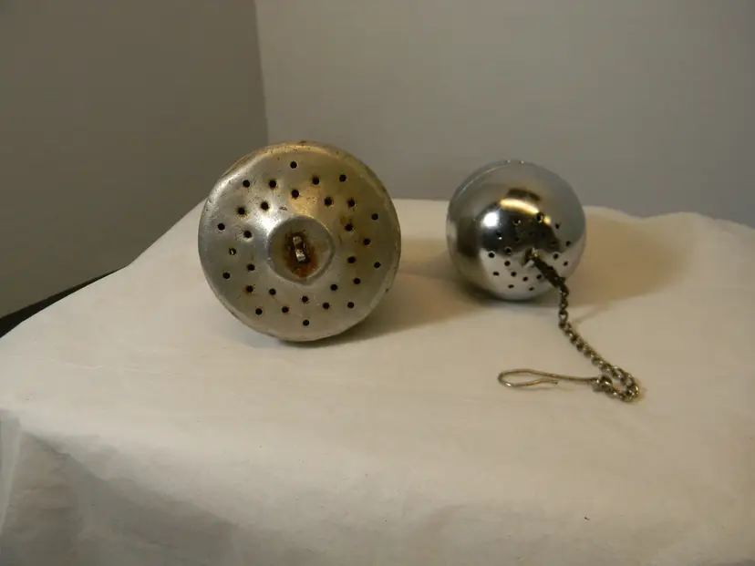 One is Vtg tea Infuser and other one is newer in age tea infuser