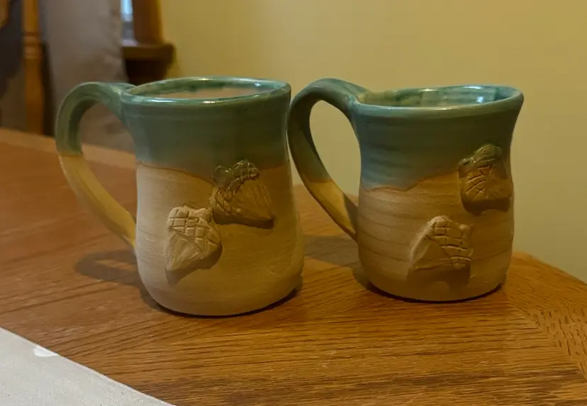 pottery mugs two-tone glaze of green and beige decorated with raised acorns 4.5”