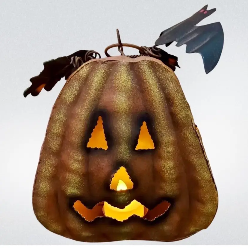 Jack-O-Lantern Tea Light Candle Holder Painted Metal Orange Yellow Green Leaf  Brown Bat 
7” T x  5-1/2” L x 3” W