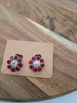 TJG The Jewelry Group Gold Tone Red and Clear Rhinestone Flower Shaped Clip on Earrings.