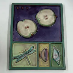 Handmade Eartha Pottery Tile Or Trivet Featuring A Dragonfly, Cut Apples, Shell, And A Bowl.  Has A Tiny Mark On The Side See Photos For Details.