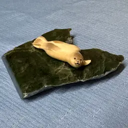 Sold
Seal Inuit carving on Dark Green Stone Slab seal is 3” long