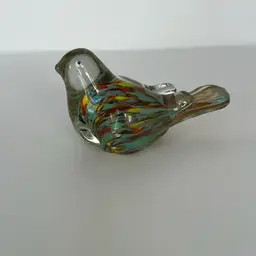 Art Glass Bird With Multi Colored Swirls In Body Pulled To Tail. Glows 2” High 3.5” Long
