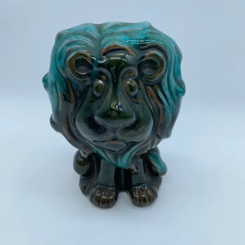 #2236 Vintage Blue Mountain Pottery lion coin bank with a drip glaze.