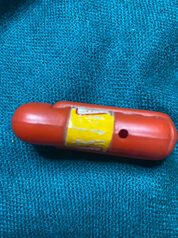 Oscar Meyer Weenie Whistle. Very well loved as you can see in the pictures.  It’s a whole 2.25 inches long. Just like the one in the movie The Santa Clause.