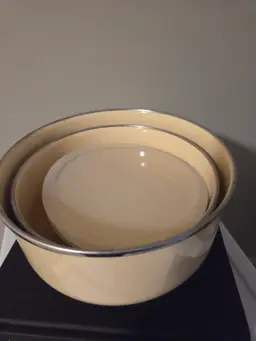 Vintage Pale yellow enamel-coated metal nesting bowls with 1 lid