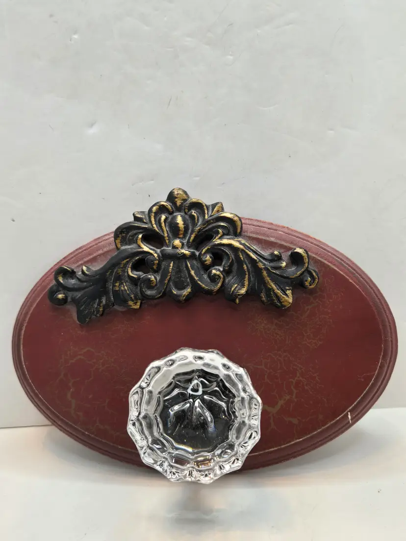 Vintage Red Wall Hook with Ornate Black and Gold Accent
