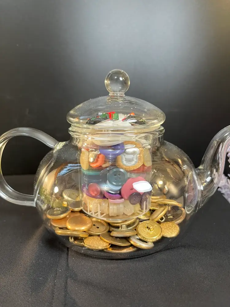 "Brewed to Perfection, buttoned with Love!"