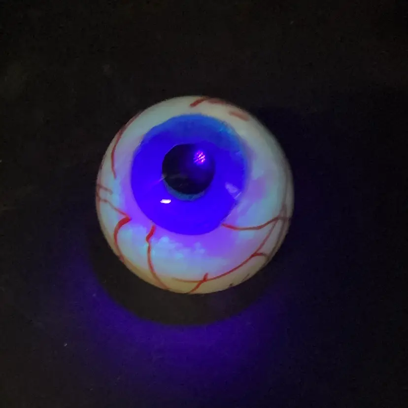 Sold Out Dynasty Gallery  Blue Eye Ball Paper Weight Glows Blue