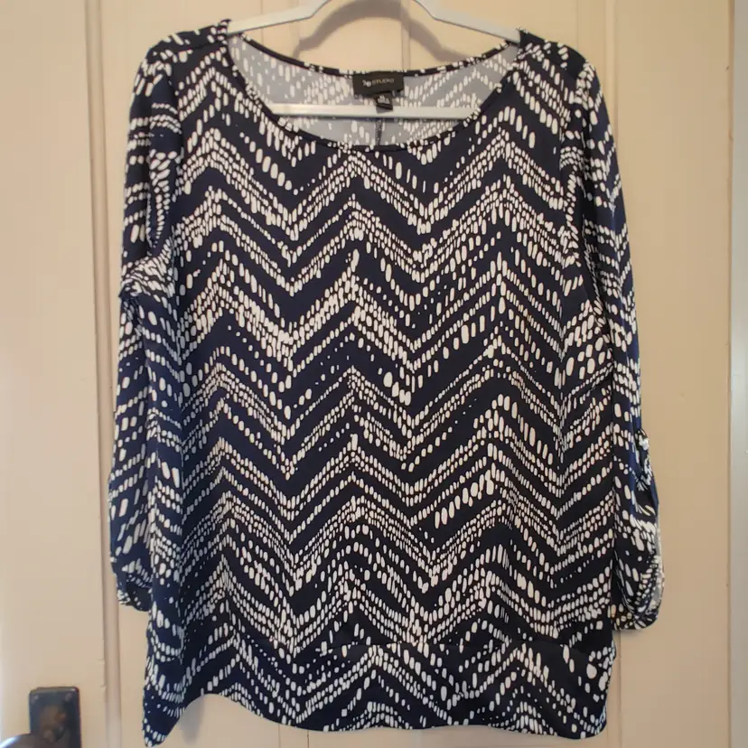 Top- Brand: AB Studio. Size XL. Navy cream top. Material- 95% polyester, 5% spandex. No callouts.