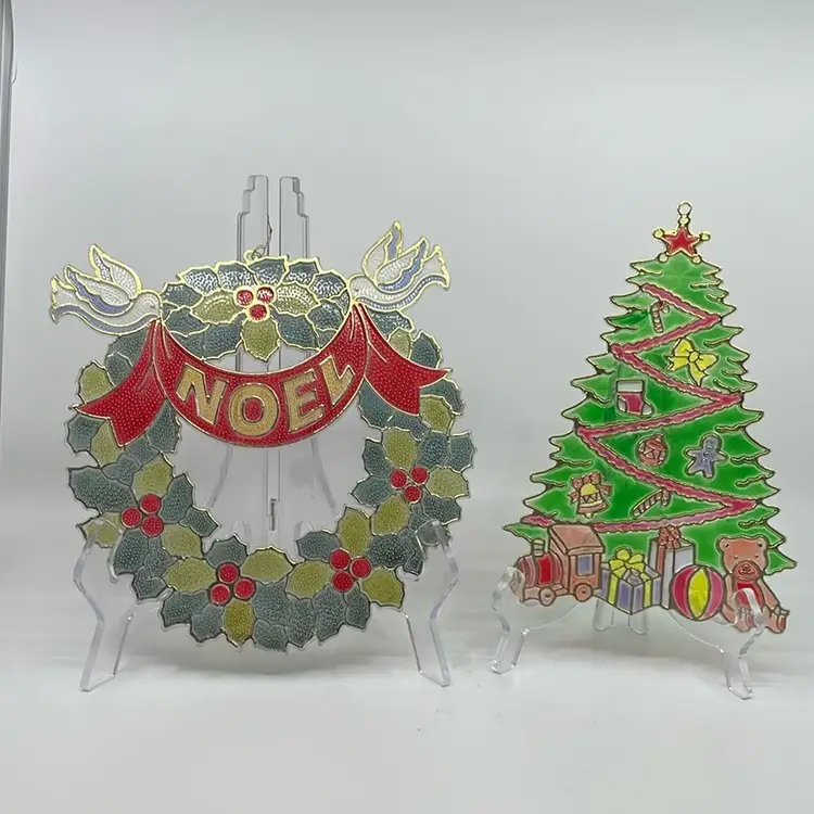 Pair Of Vintage Kitschy Plastic Christmas Window Sun Catchers. Christmas Holly And Berries Wreath With Noel Banner And Doves AND Christmas Tree With Ornaments Star And Presents