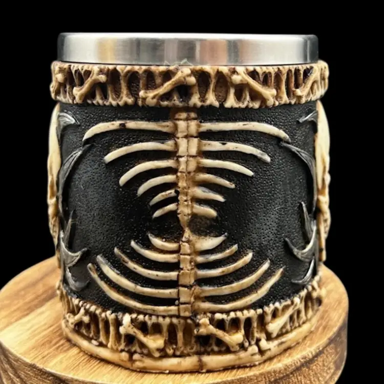 #238B Premier Exhibitions Evil Grinning Tribal Skull Mug With Skulls. Skeletal Spine Bones HandleResin With Stainless Insert