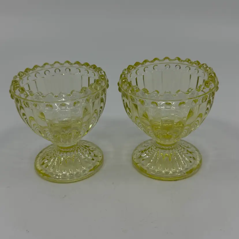 2 Vintage Yellow Glass Egg Cups Sawtooth Edge Ribbed Pattern Glow Blue